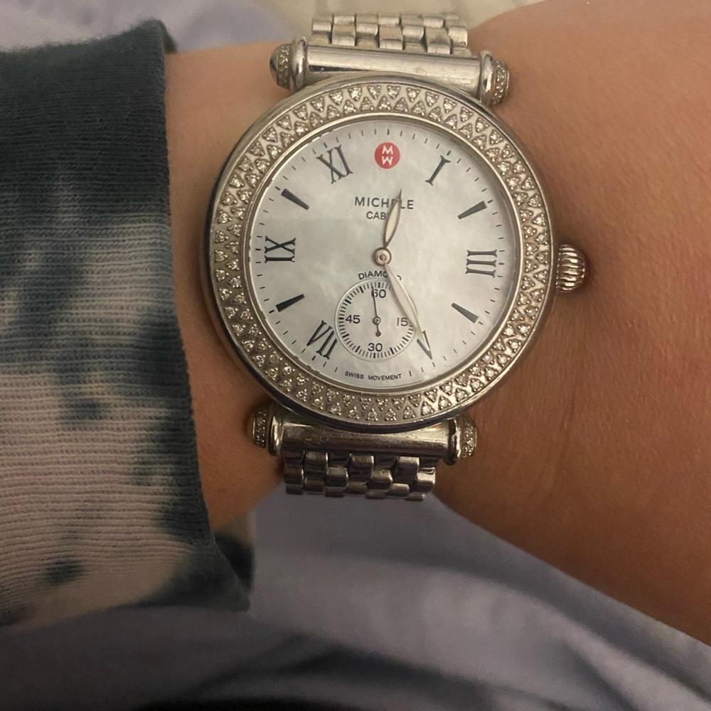 Michele watch silver, mother of pearl face and diamonds around the face.